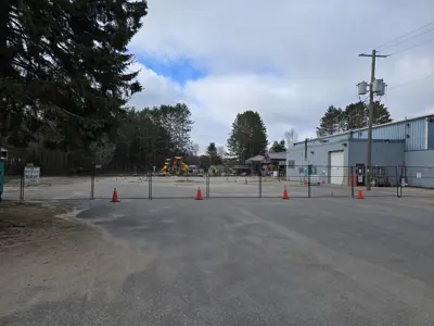 Secured fenced area in parking lot beside the Community Centre, Arena and Library in Baysville.