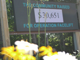 An LED sign that reads "The Community Raised $30,651 for Operation Facelift"