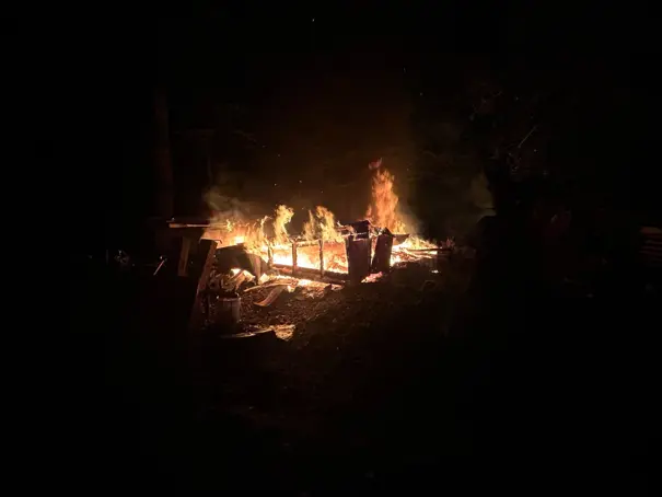 Demolished shed intentionally set on fire for disposal