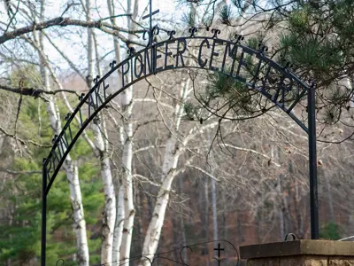 Metal archway reading 'PIONEER CEMETERY'