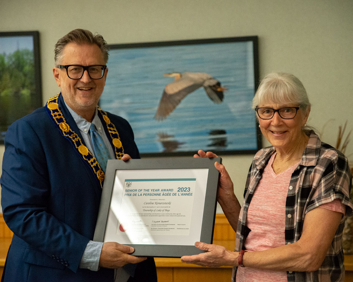 Mayor of the Township of Lake of Bays, Terry Glover (left) presenting the 2023 Senior of the Year Award to Caroline Konarzewski (right)